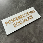 Tabliczka na drzwi POMIESZCZENIE SOCJALNE – plexi biało-złota 25x10 cm